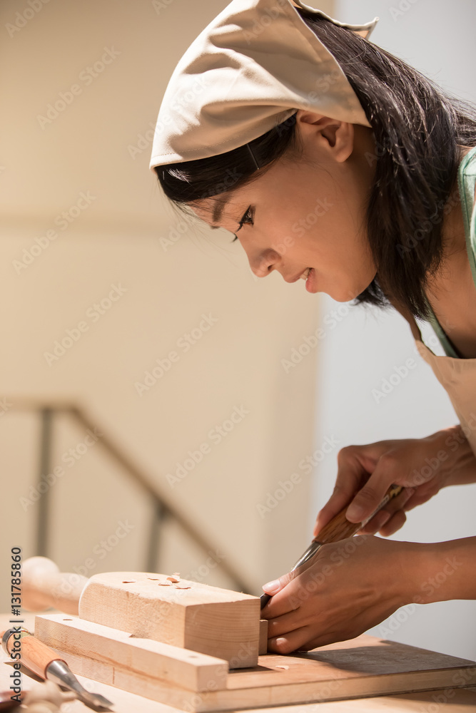 woman woodworking smile happily