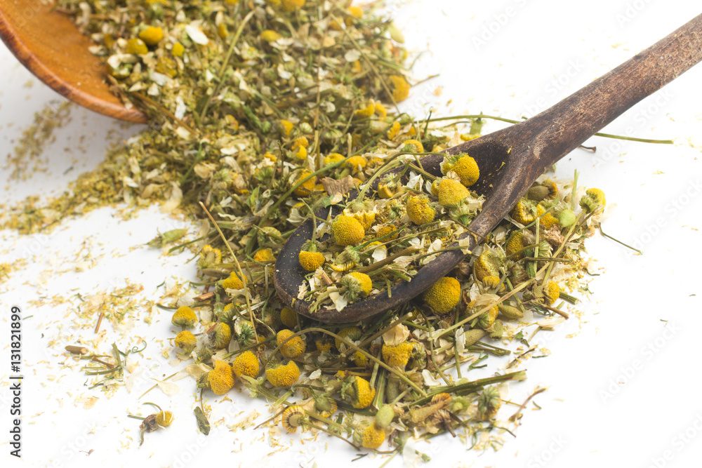 Dry Camomile Tea into a spoon