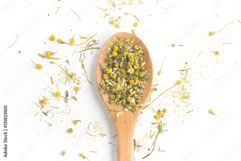 Dry Camomile Tea into a spoon