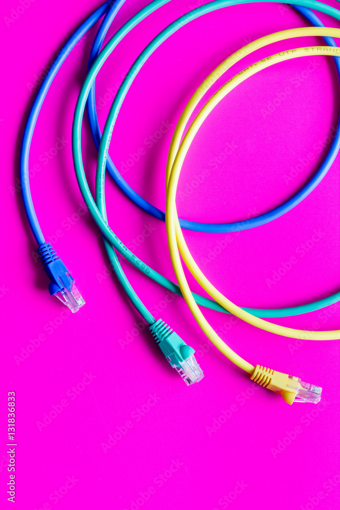 concept network internet cable on pink background close up