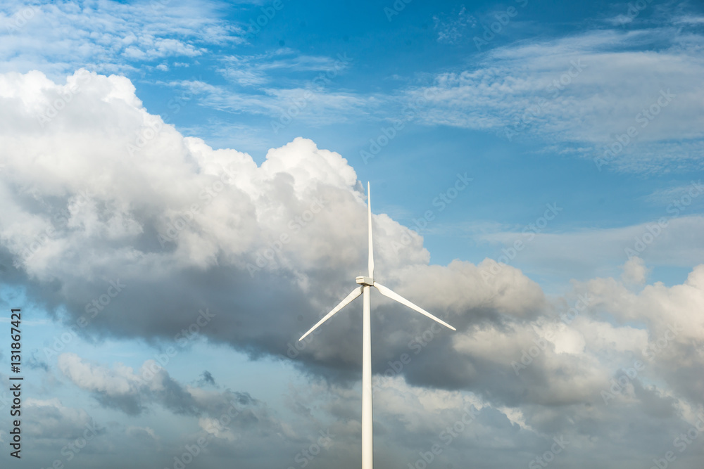 Wind turbines. Ecology wind against cloudy sky background with c