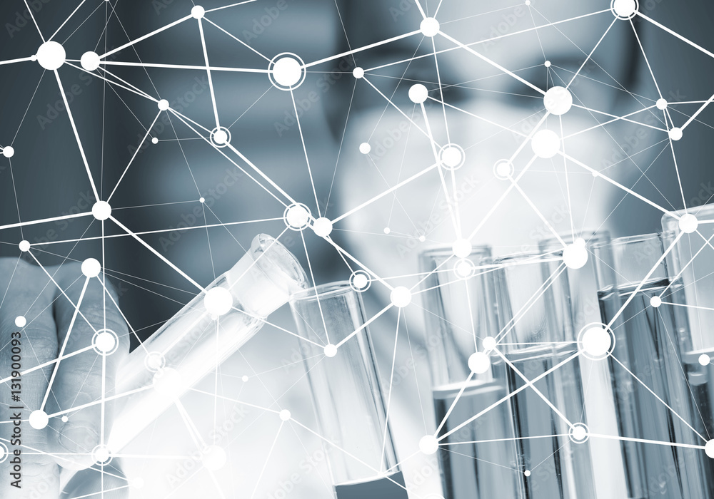 Portrait of concentrated male scientist working with reagents in laboratory