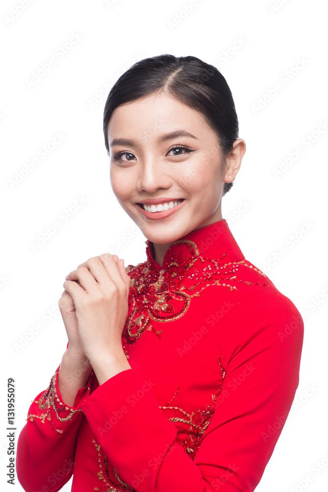 Young vietnamese woman in Ao Dai Dress with praying gesture wish