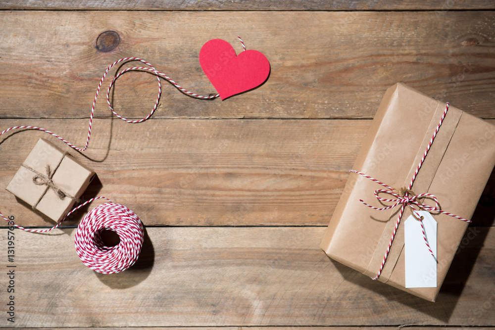 Christmas decorated gift box over wooden background. View from a