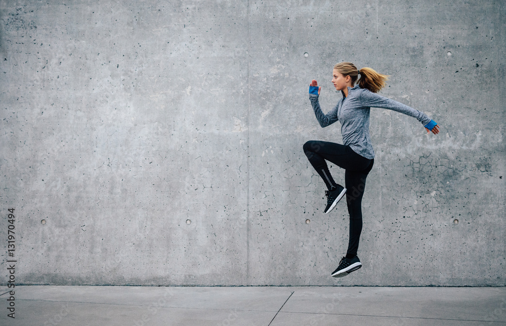 Fit young woman doing cardio interval training