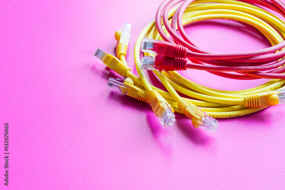 concept network internet cable on pink background close up