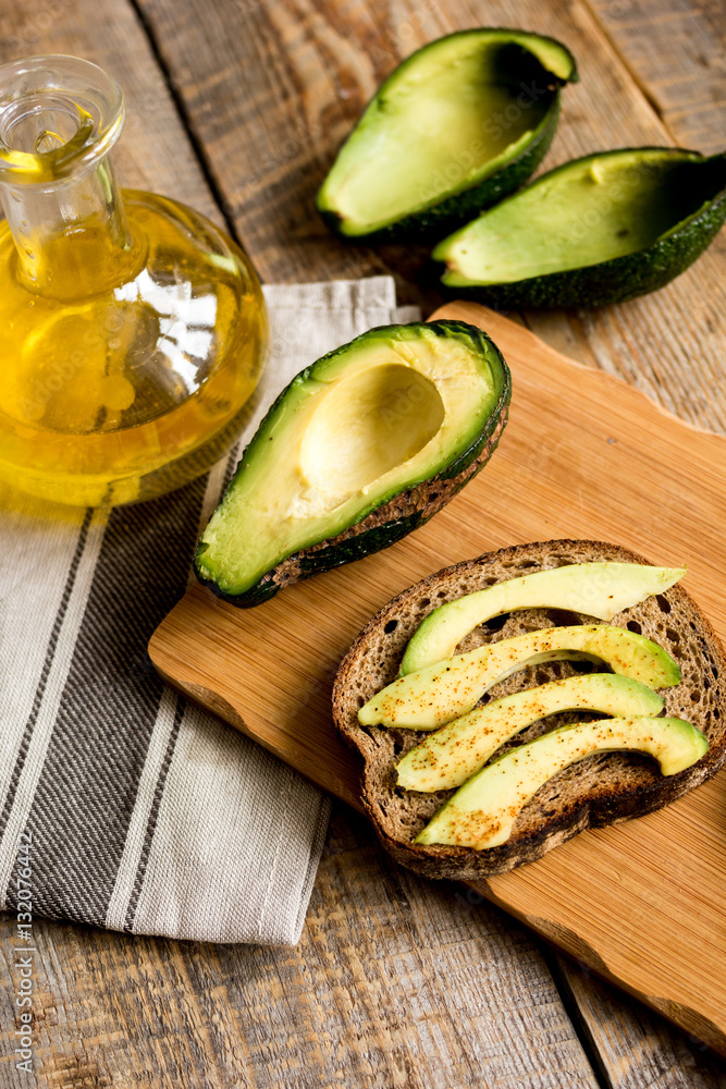 making sandwiches with avocado healthy organic food top view