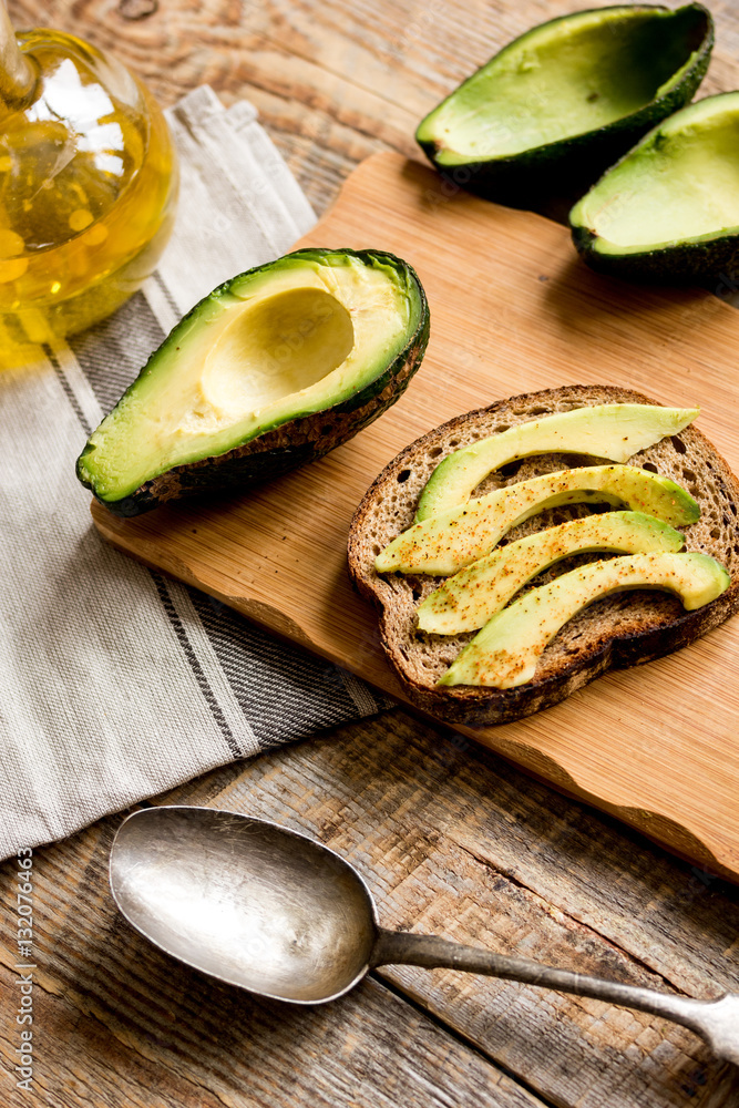 making sandwiches with avocado healthy organic food top view