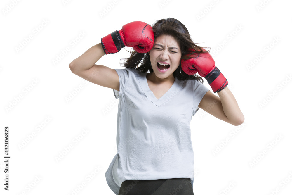 Young woman shouting with boxing gloves 