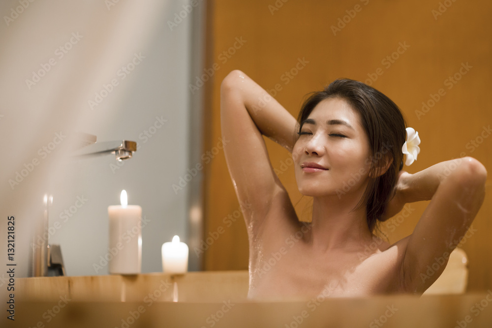 Beautiful young woman in bathtub