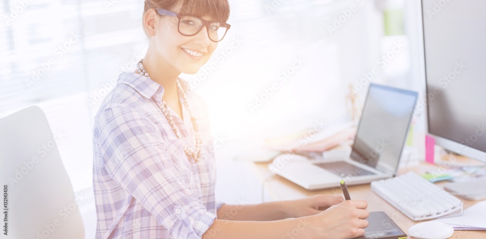 Pretty designer working on her graphics tablet