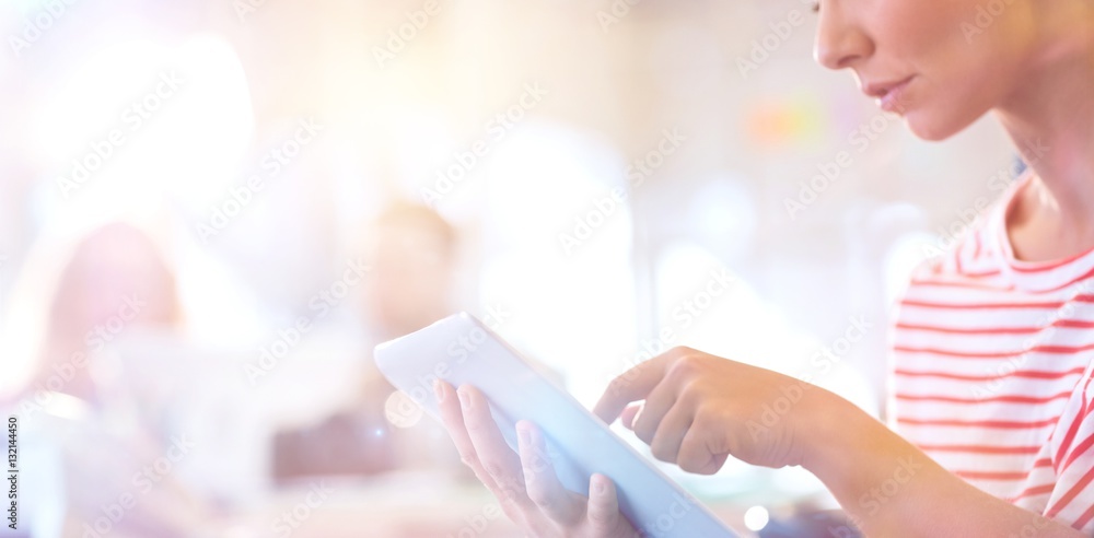 smiling young women using digital tablet 