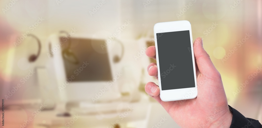 Composite image of hand of businessman holding smart phones 3d