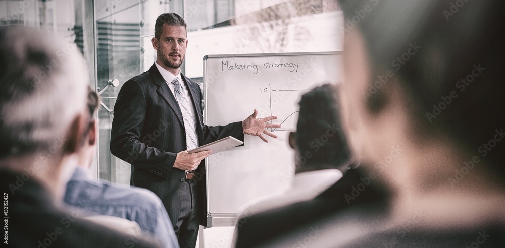 Businessman interacting with colleagues