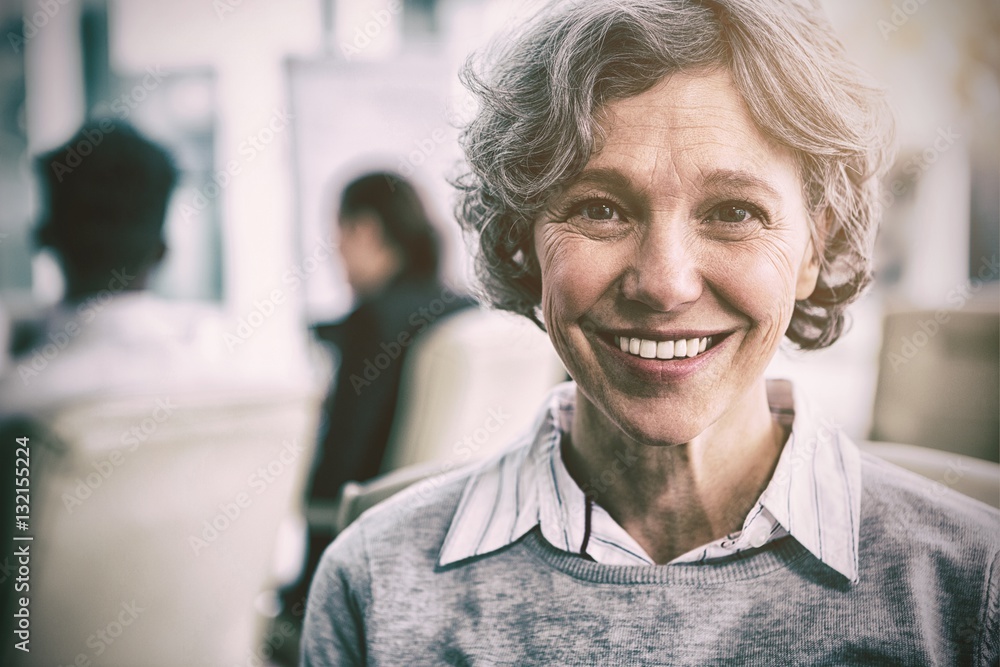 Smiling businesswoman sitting in office