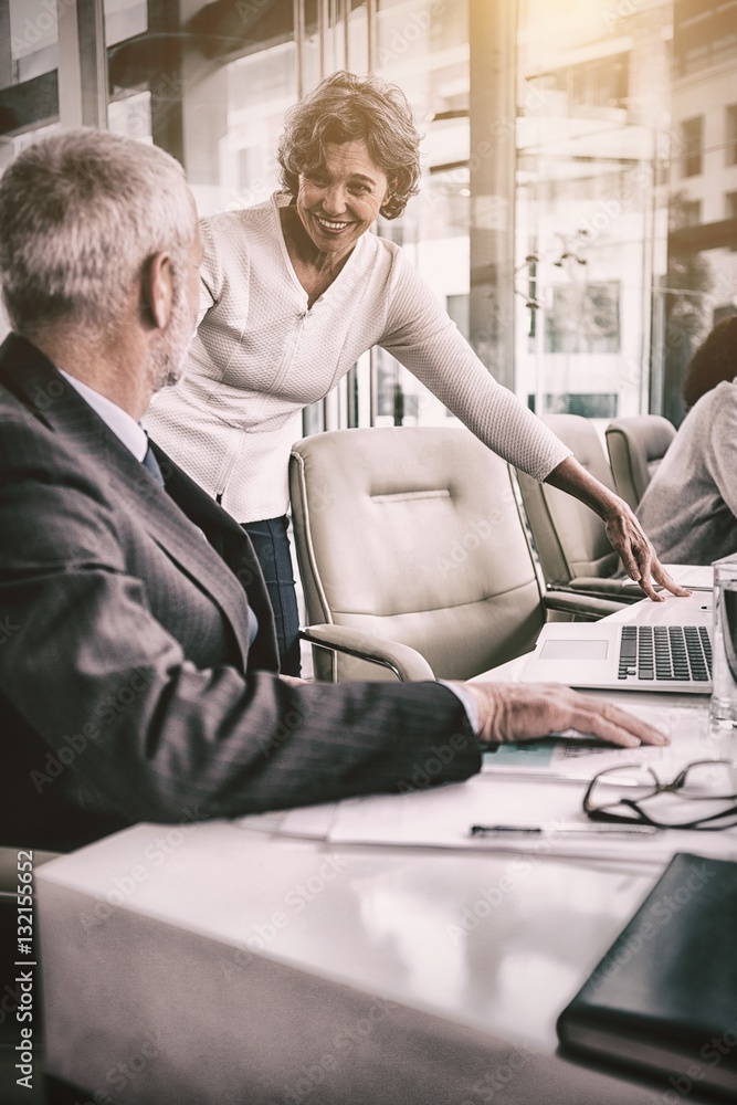 Business people interacting in office