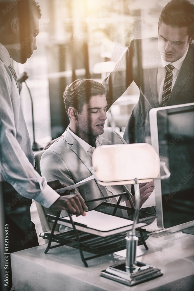 Concentrated businessmen discussing