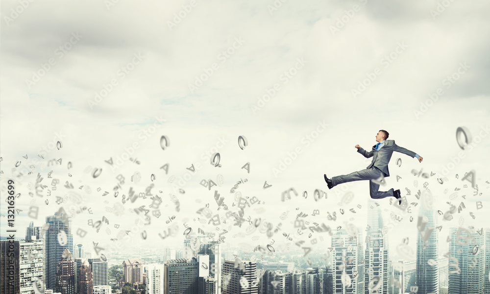 Businessman jumping high