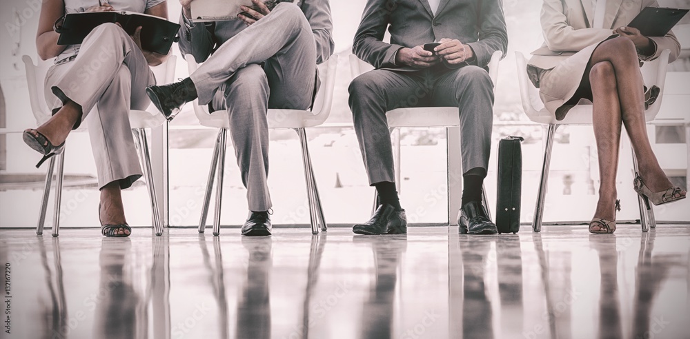 Group of well dressed business people waiting