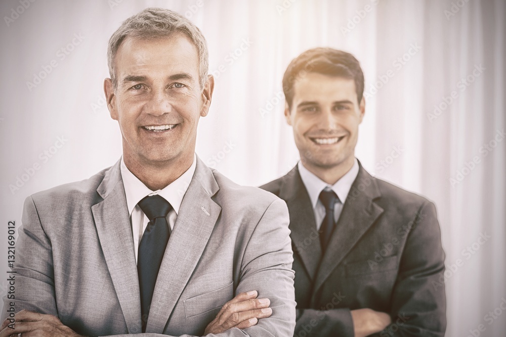 Smiling businessmen posing looking at camera