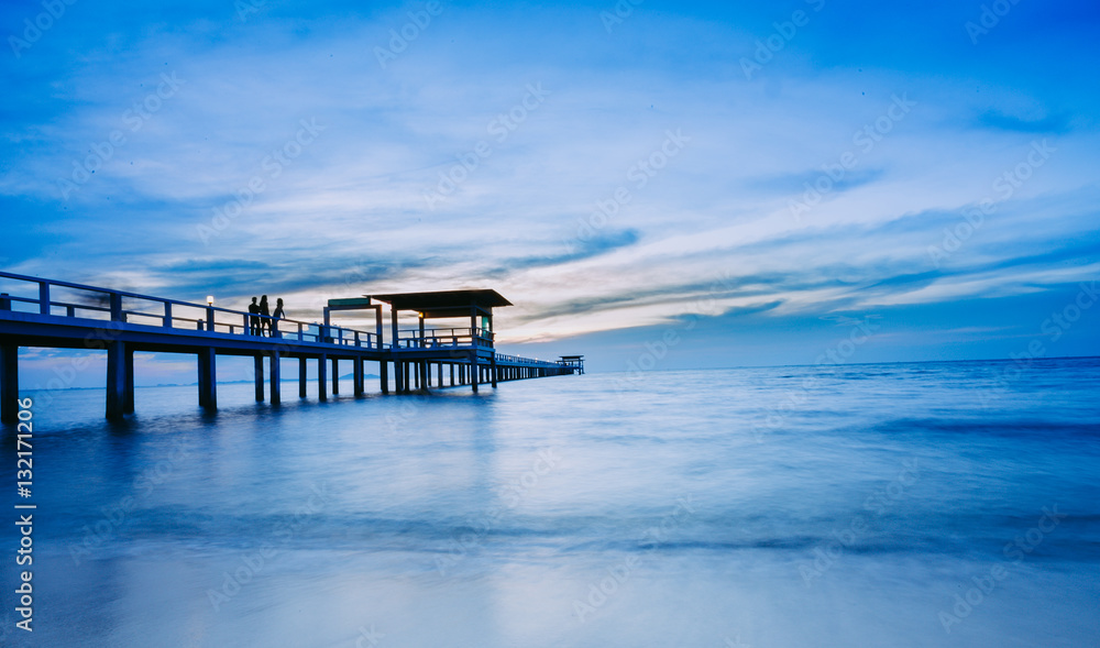 Blue sea waves and sky with airy clouds