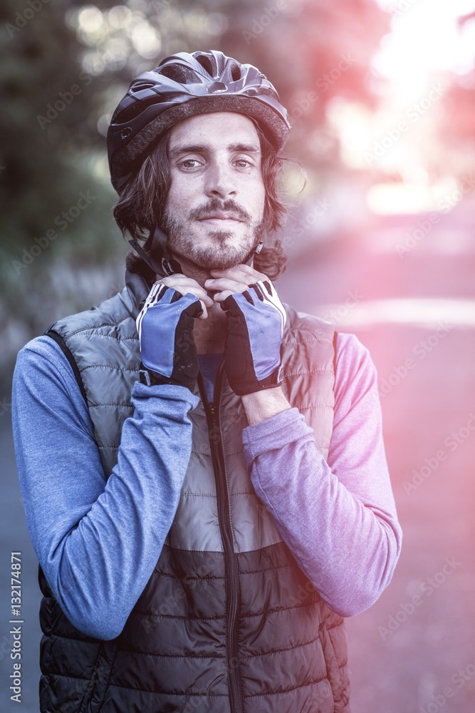 Portrait of male biker wearing bicycle helmet