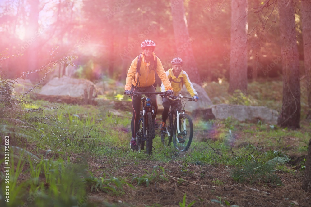 Biker couple cycling in countryside