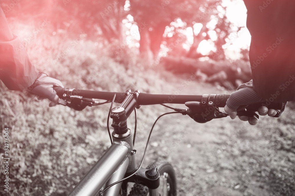 Close-up of male mountain biker riding bicycle