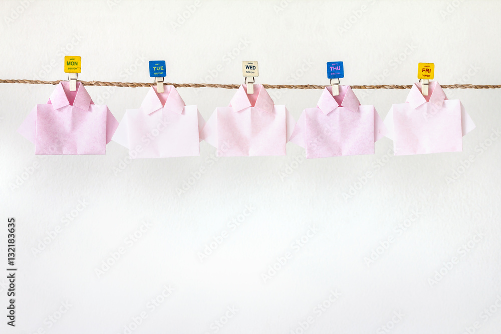  white origami shirt paper hanging  on rope , happy friday 