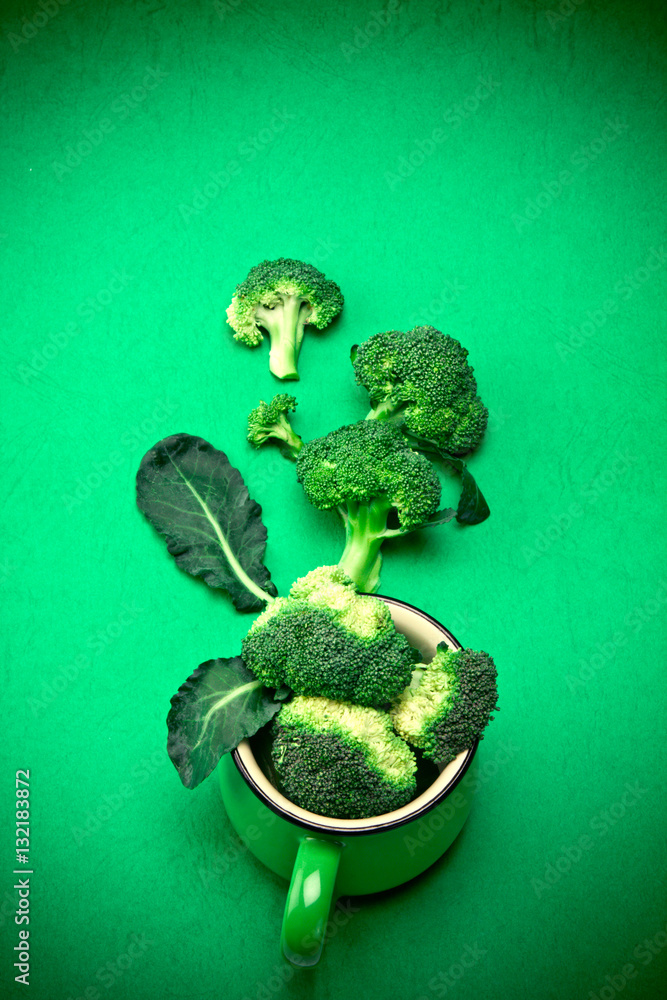 Fresh Broccoli on green background , nature green food concept