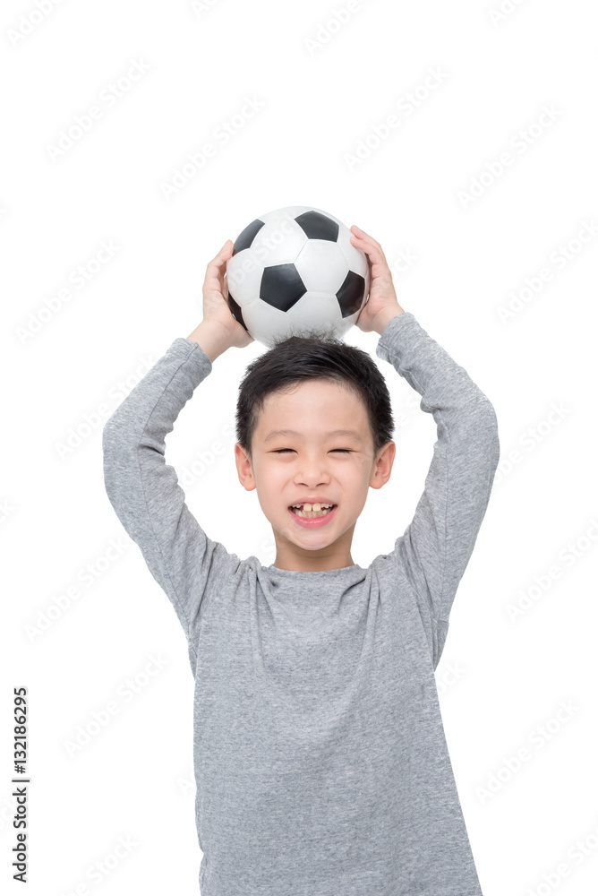 Young Asian boy holding ball over white