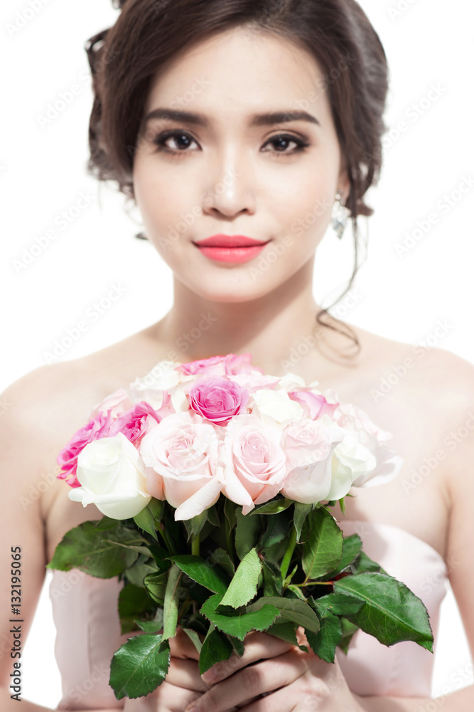 Happy bride with a bouquet of roses. Isolated on white backgroun