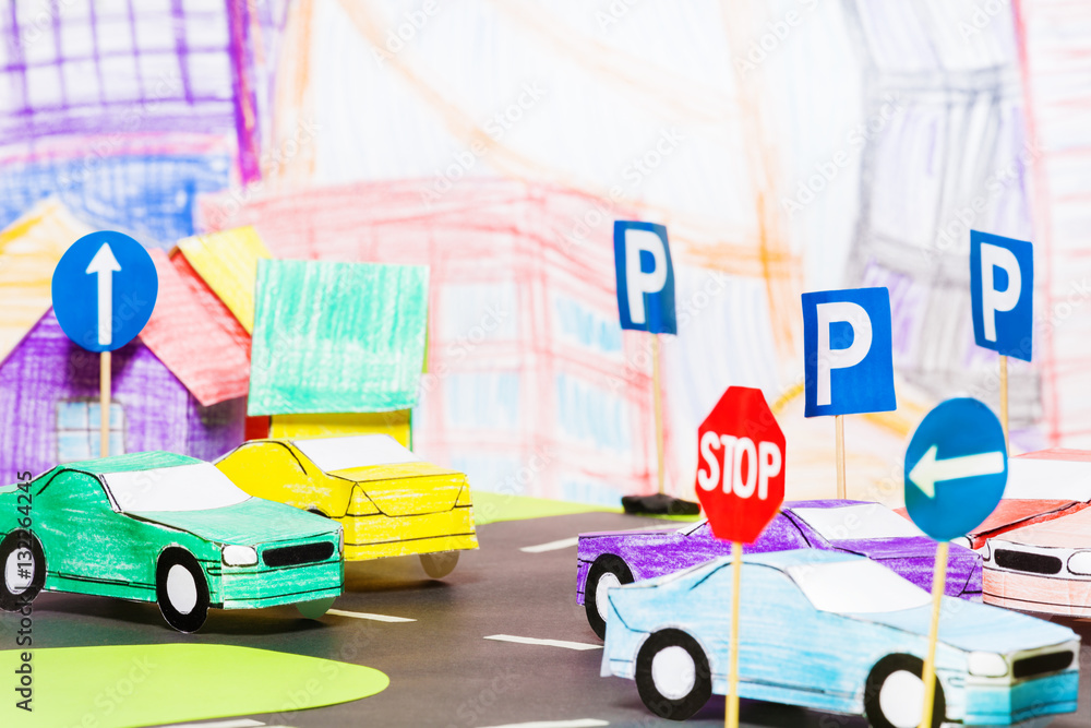 Road traffic in the toy town with handmade cars