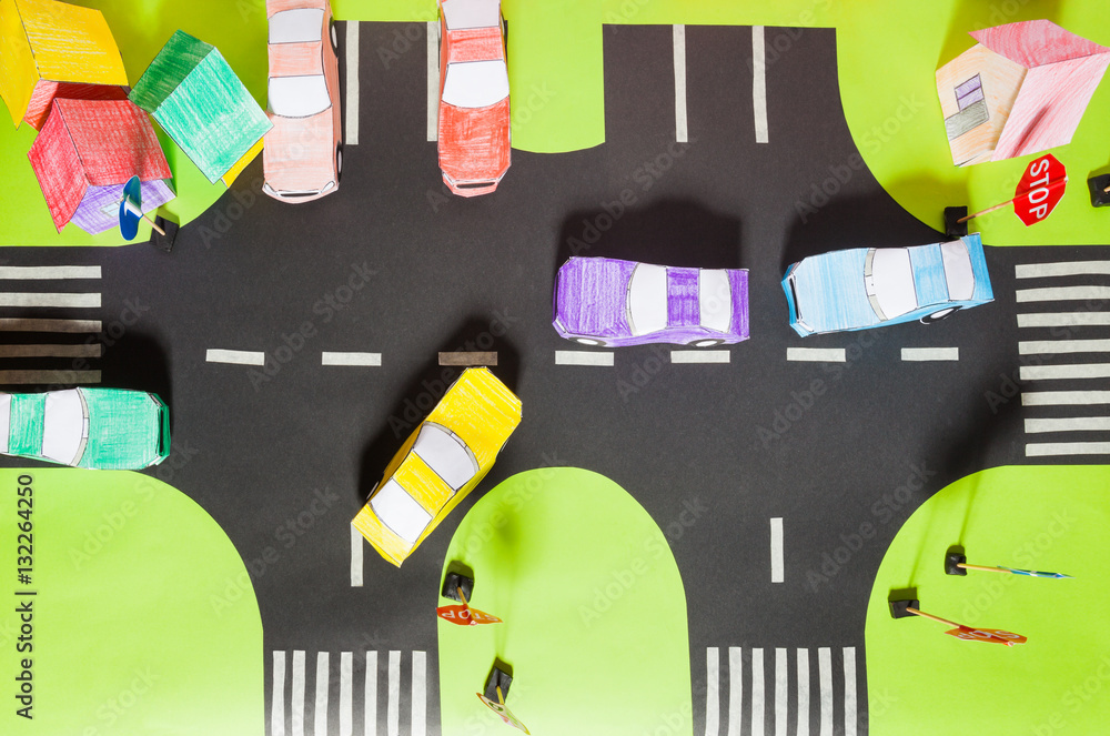 Model with crosswalks, signs, parking and toy cars