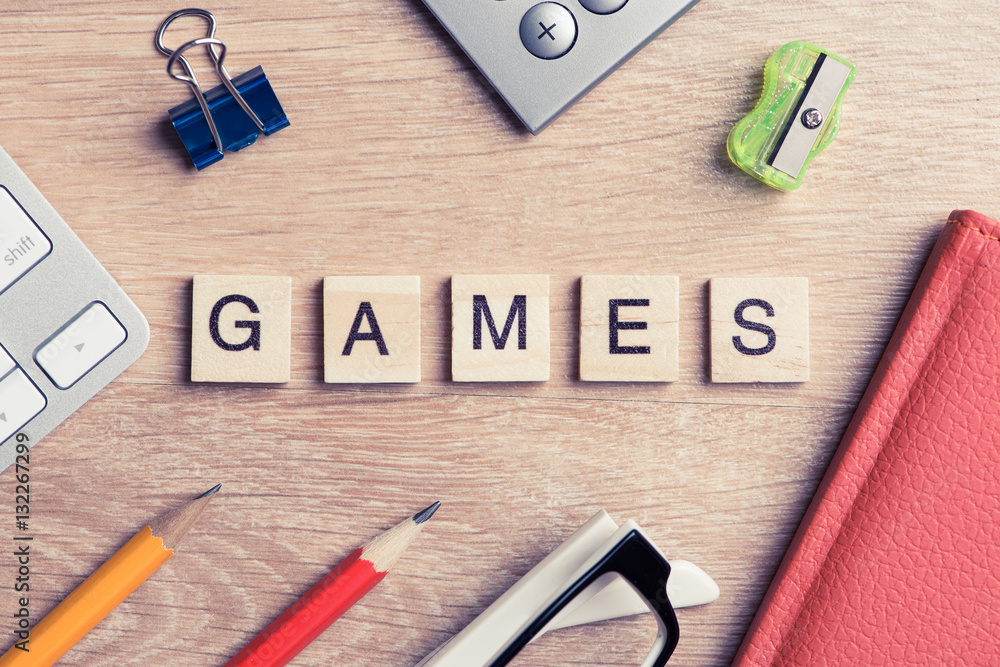 Elements of education game spelling words on wooden office table