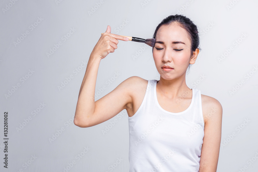 asian beauty girl  force to makeup beauty concept on white backg