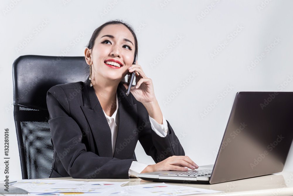 Charming young woman in formalwear computing in office