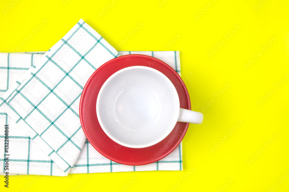 top view of empty white coffee or tea cup with red dish 