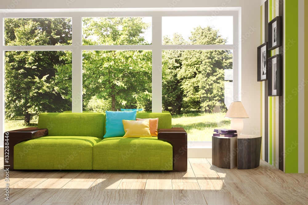 White room with sofa and green landscape in window. Scandinavian interior design