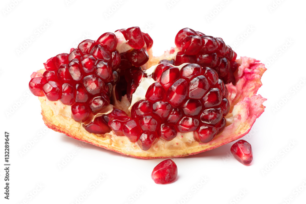 Ripe pomegranate fruit isolated on white background. Grains.