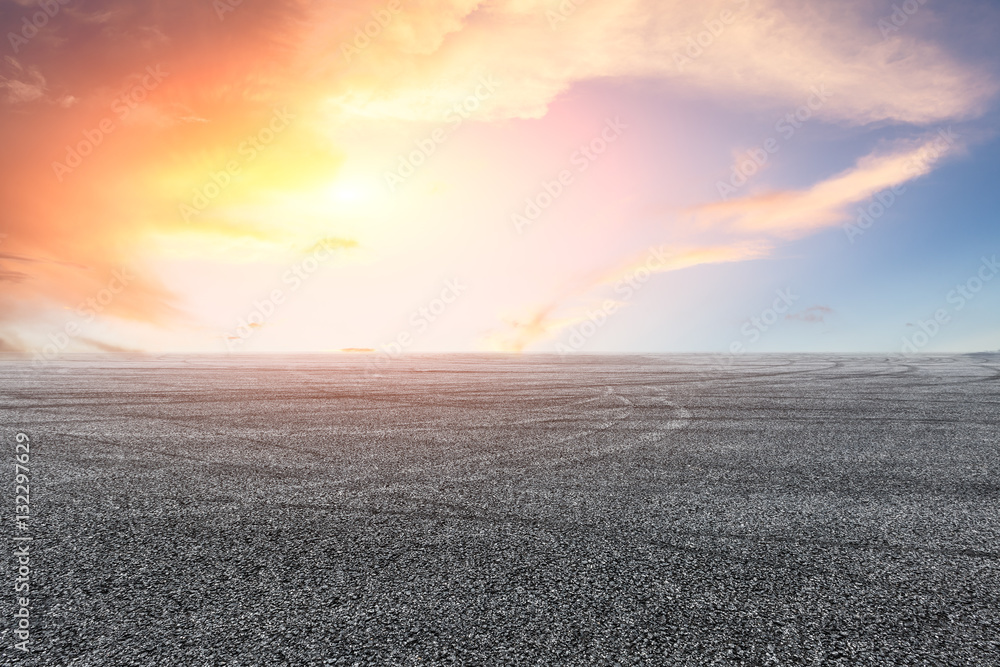 Asphalt road and sky at sunset