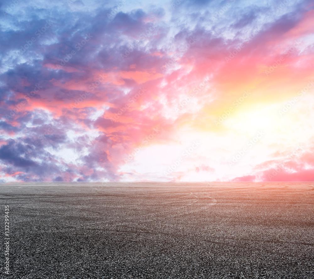 Asphalt road and sky at sunset