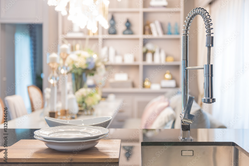 modern faucet sink in pantry with luxury dining room