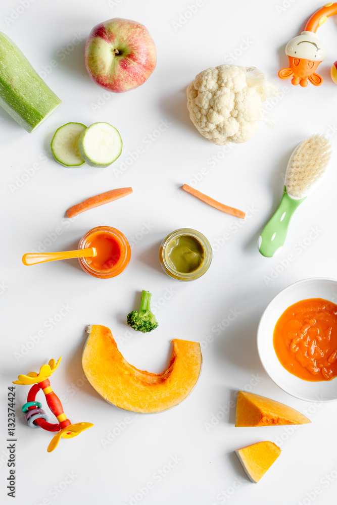 cooking vegetable puree for baby on white background top view