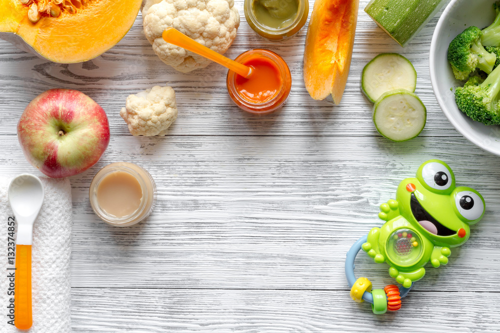 baby vegetable puree on wooden background top view