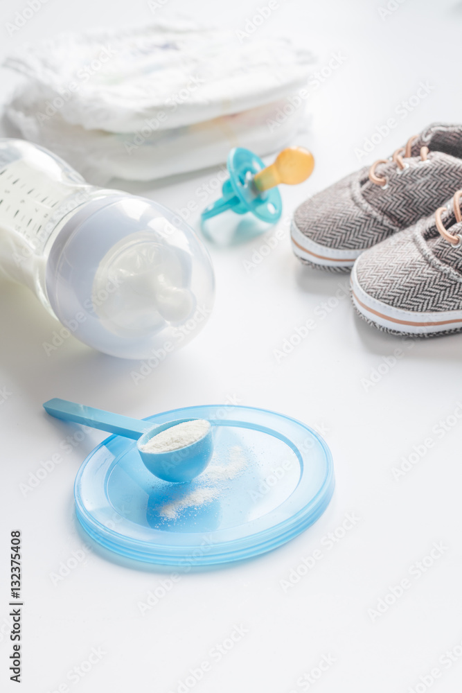 preparation of mixture baby feeding on white background