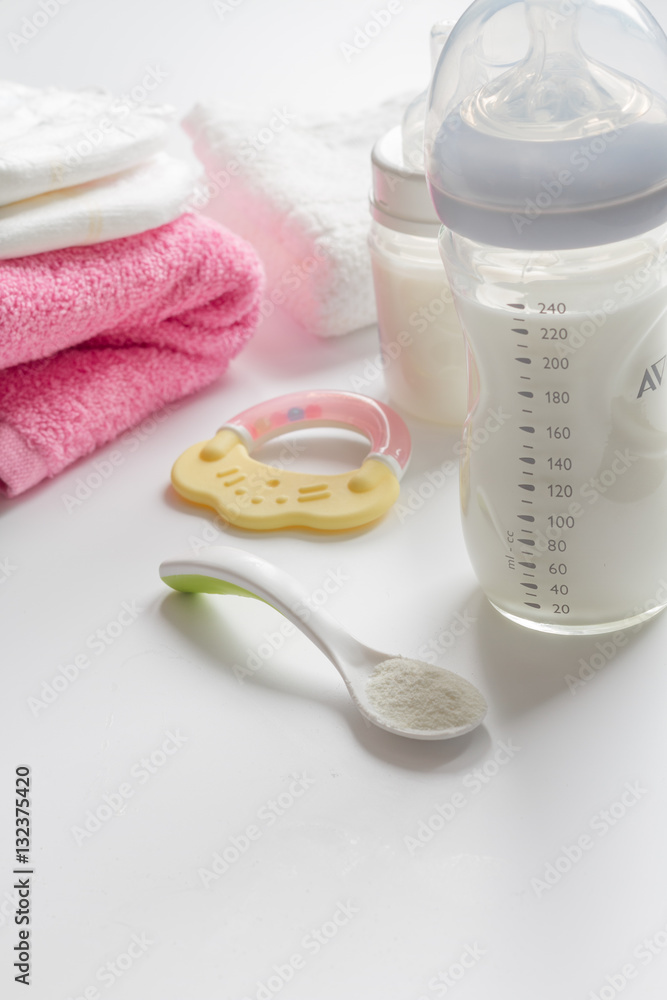 preparation of mixture baby feeding on white background