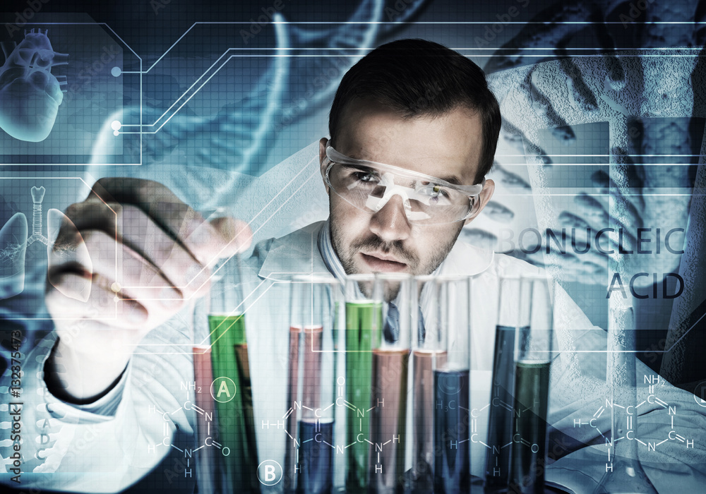 Portrait of concentrated male scientist working with reagents in laboratory