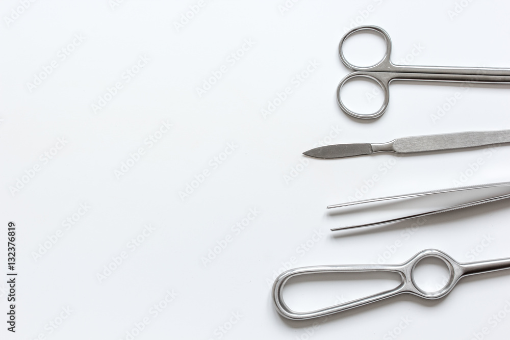 instruments for cosmetic surgery on white background top view