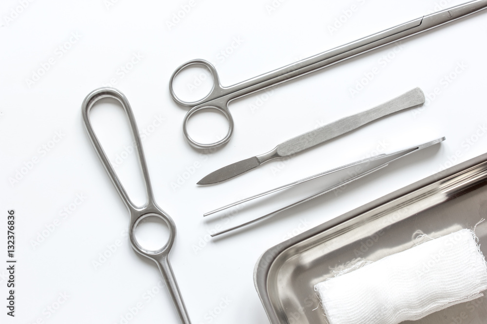 instruments for cosmetic surgery on white background top view